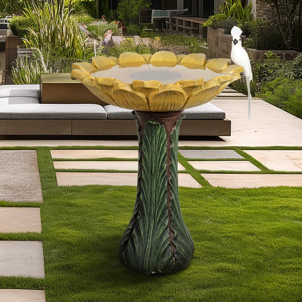 24.4" tall sunflower shaped concrete birdbath in a vibrant flower garden