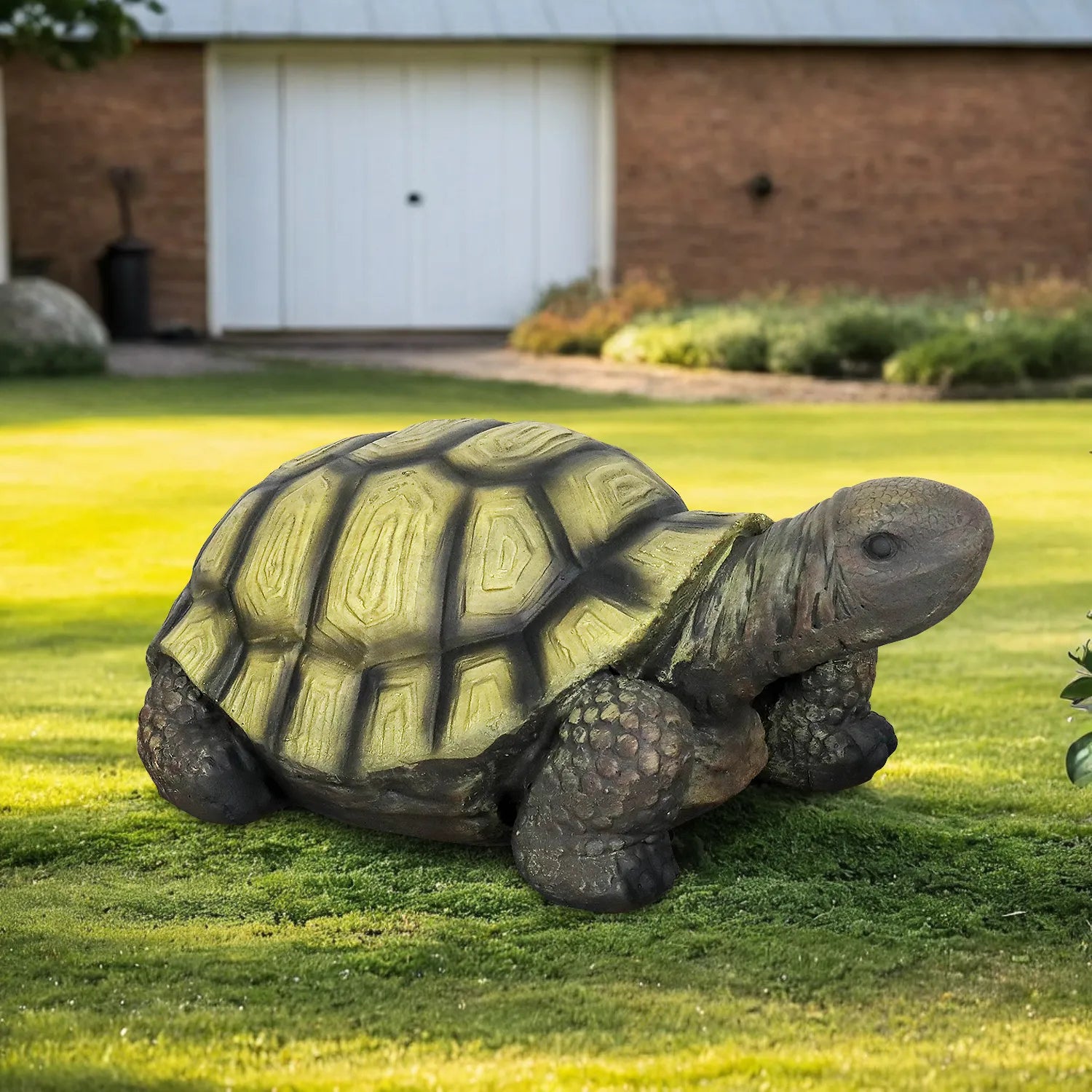 34-inch large turtle garden figurine placed on a manicured green lawn.