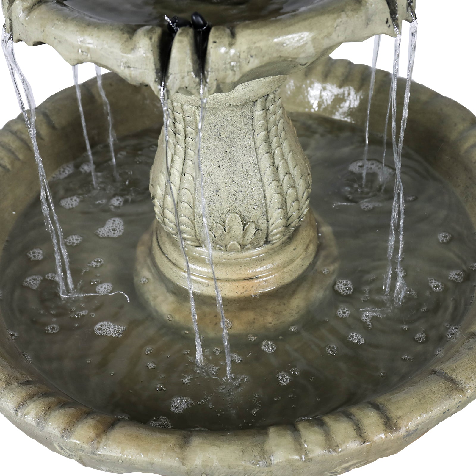 Close-up of the soothing multilevel water cascade flowing through the tiers of the garden fountain.