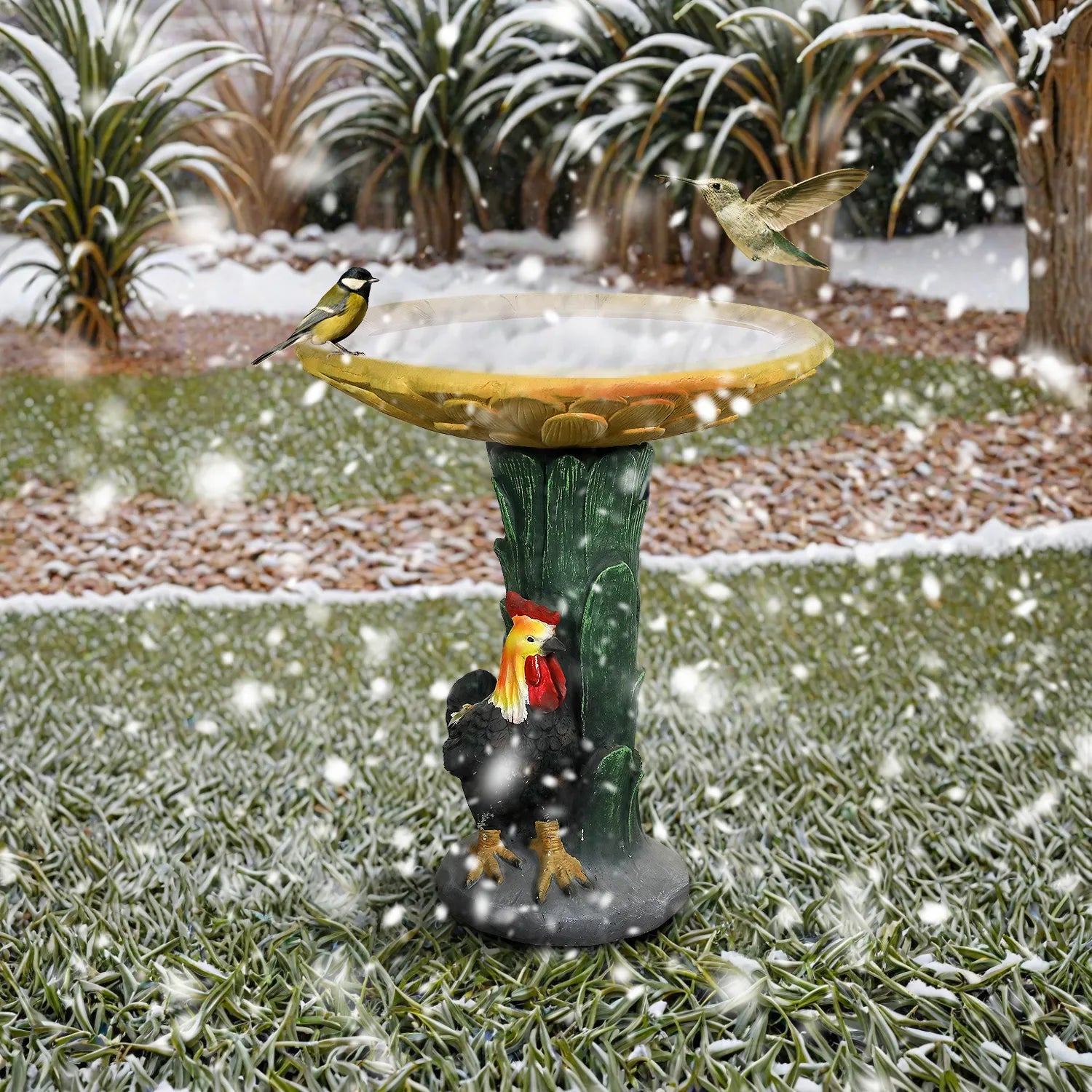 Durable concrete sunflower birdbath standing in the snow, showing weather-resistant properties.