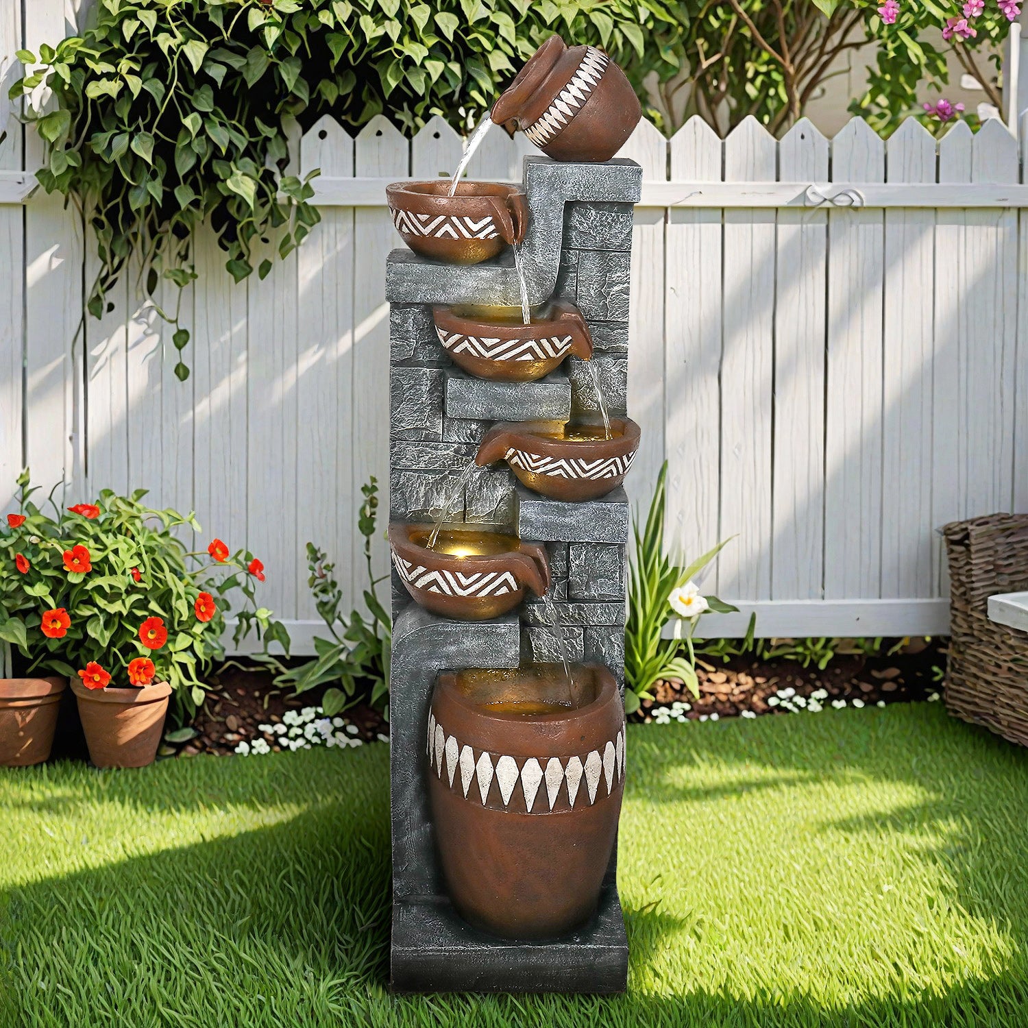 Rustic-bohemian outdoor floor fountain decorating a cozy farmhouse patio