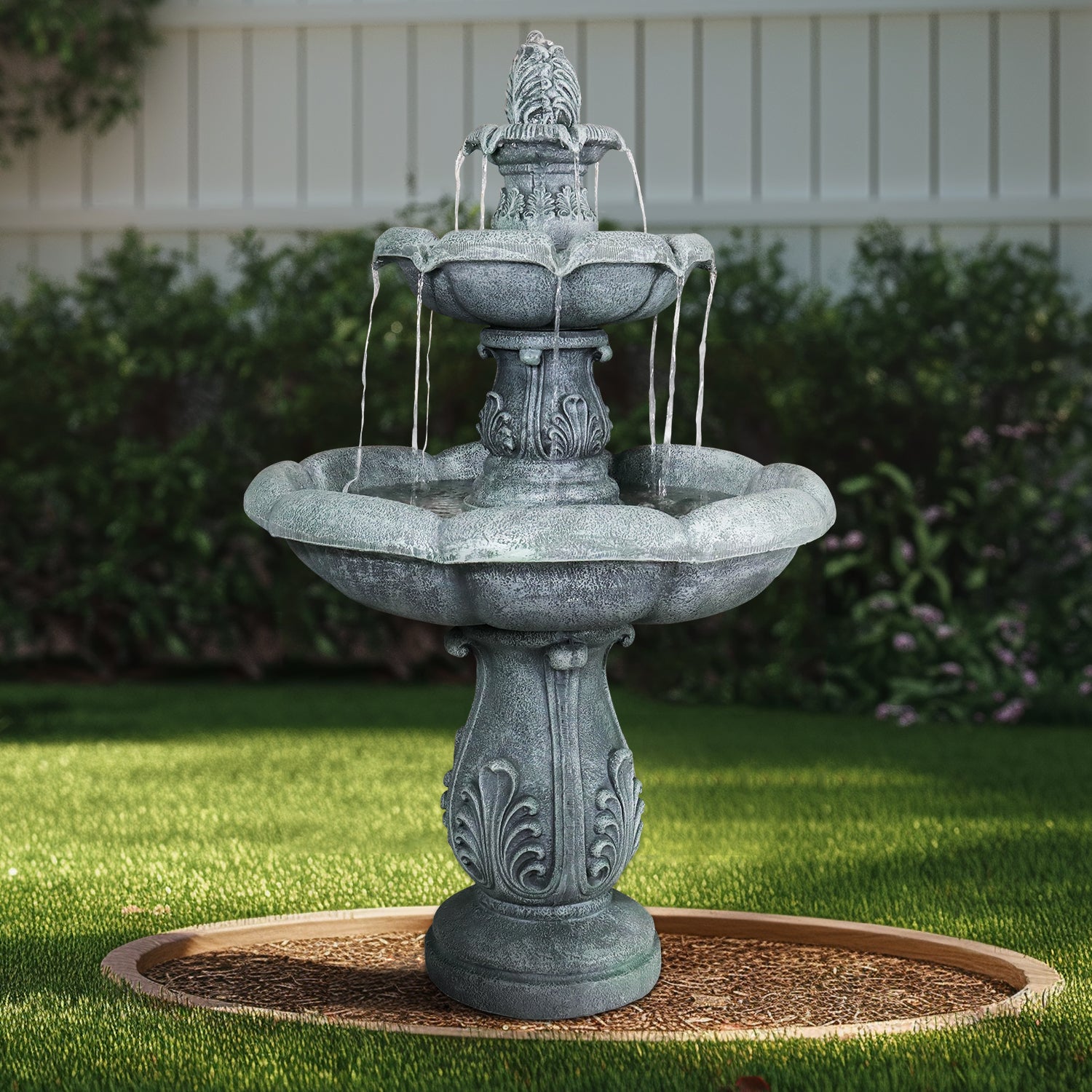Timeless ornate design of the 48"H classic fountain bringing tranquility to a sunlit yard.