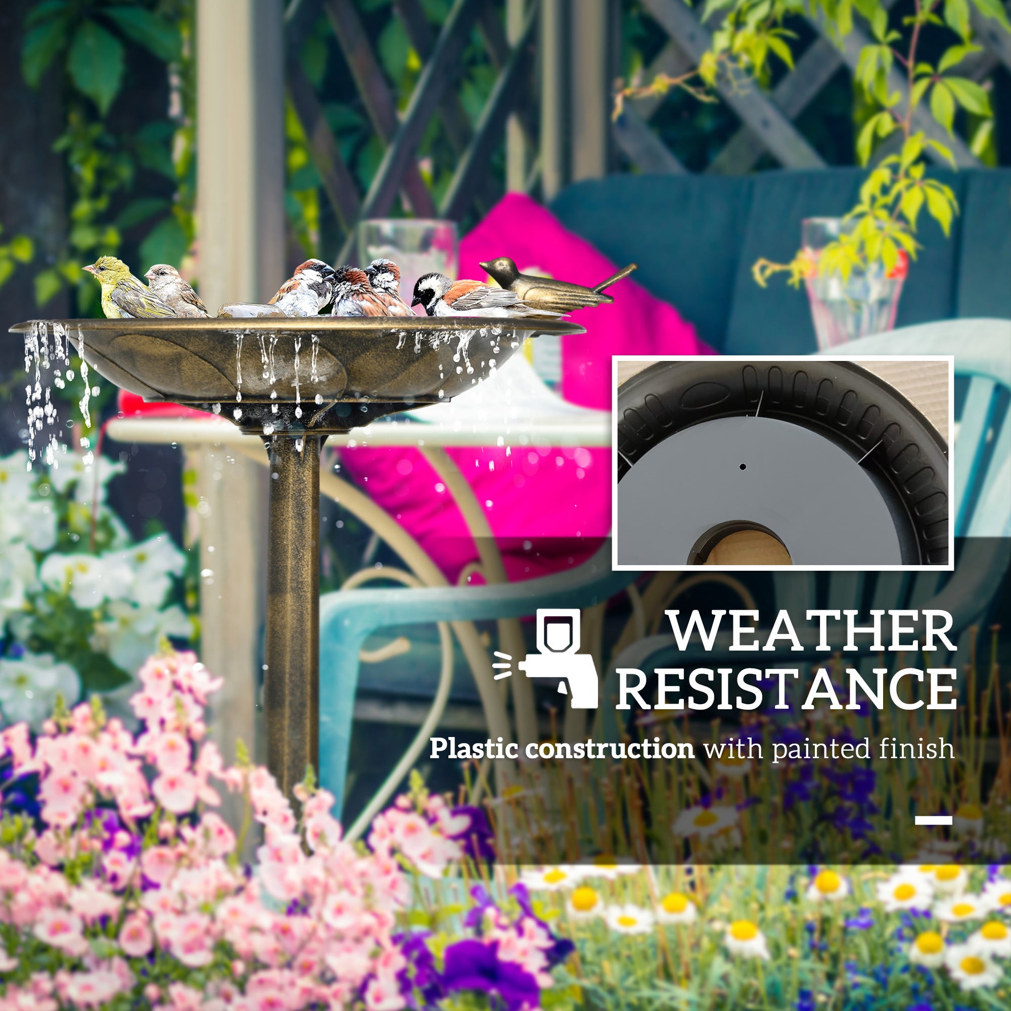 antique bird bath in a flower garden with pink blooms near patio seating