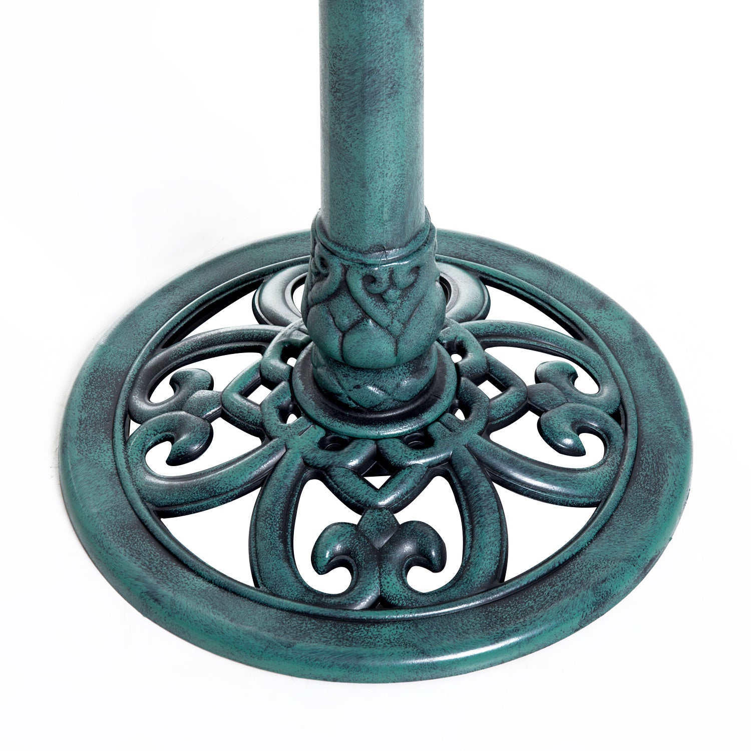fleur-de-lis scrollwork detail on green verdigris bird bath base