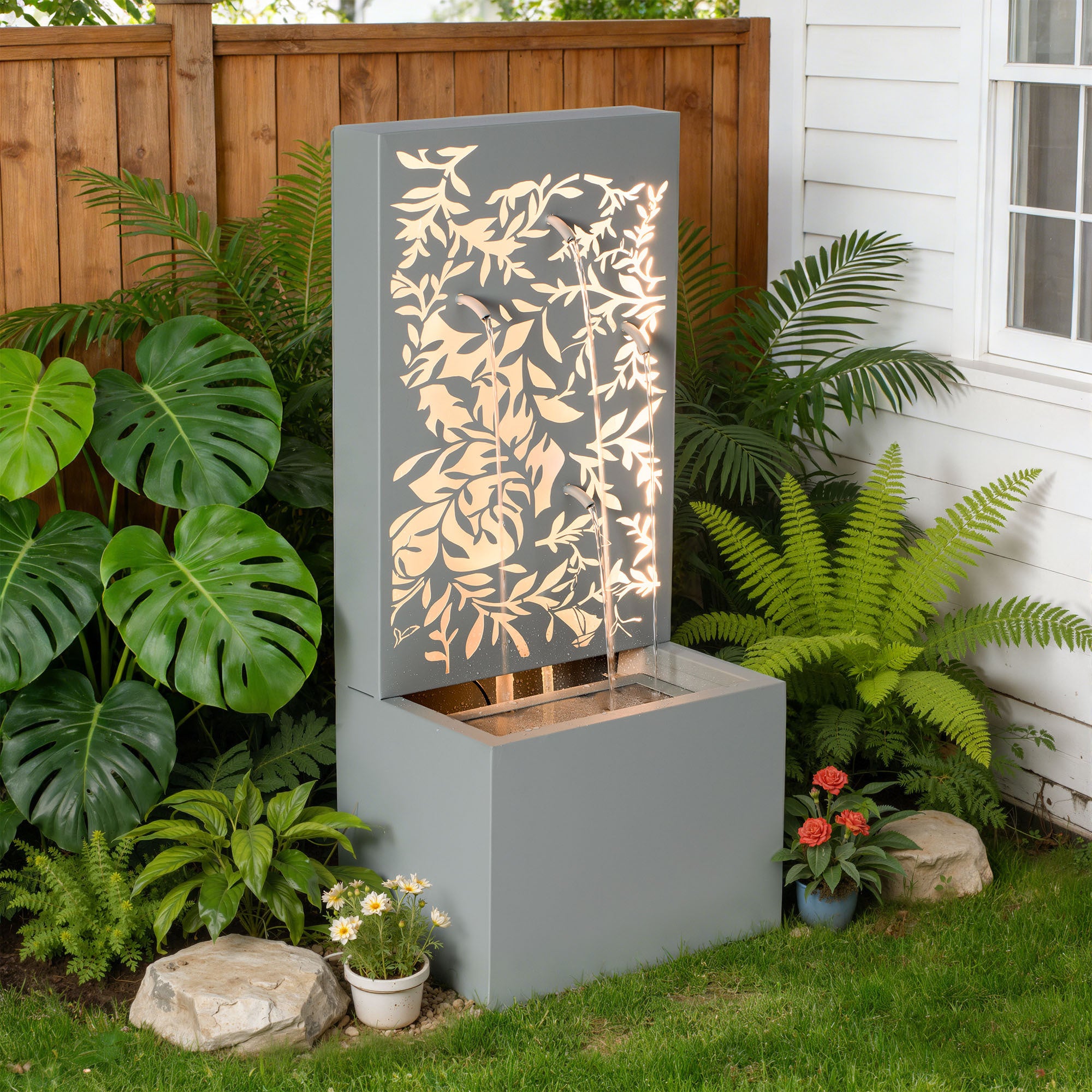 leaf wall cascade fountain on patio near house exterior