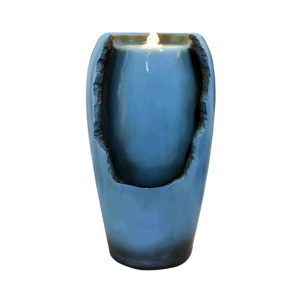 Front view of blue resin tabletop water fountain with illuminated top