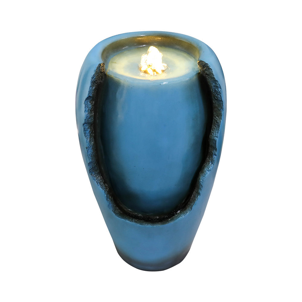 Top view of LED light and water outlet on blue vase tabletop fountain