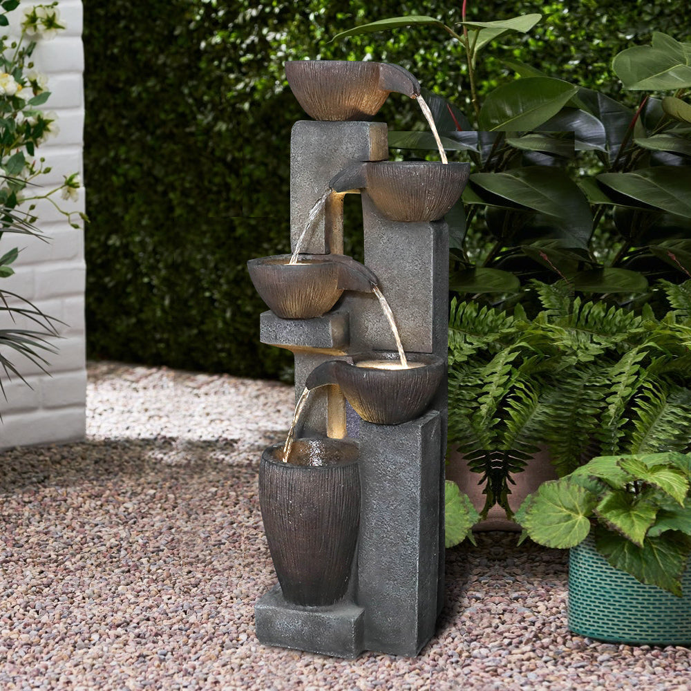 39 inch tall 4-tier pots garden outdoor fountain surrounded by blooming greenery