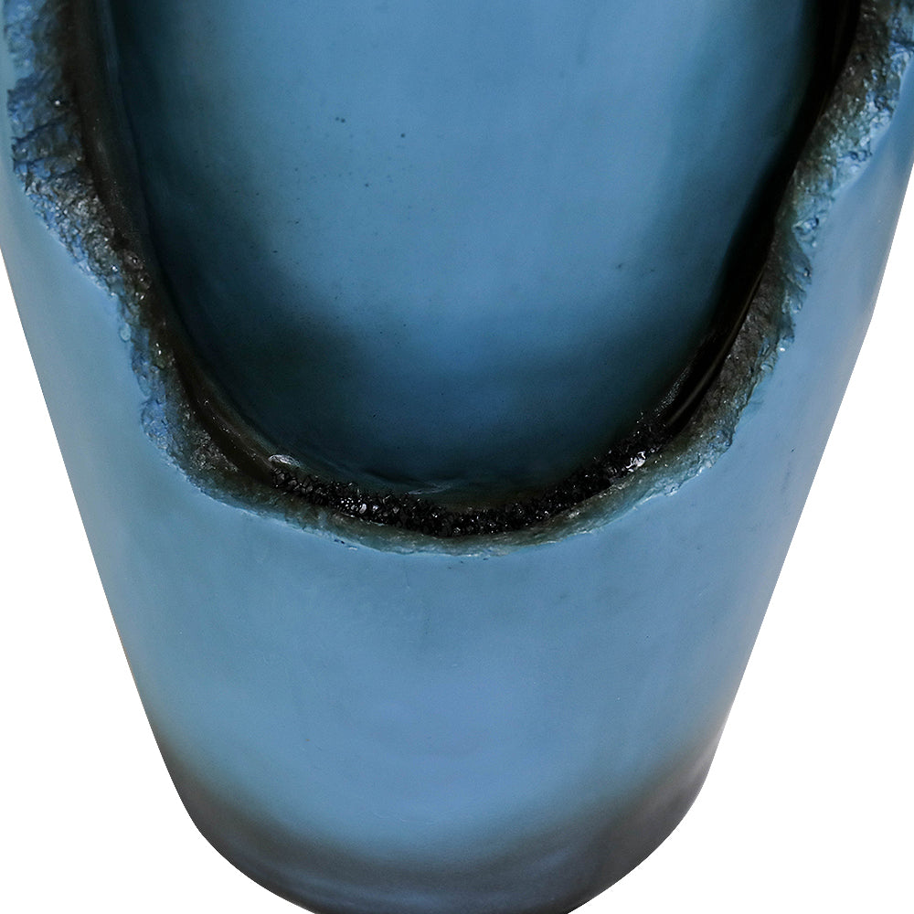 Close view of recessed water wall on blue resin tabletop fountain