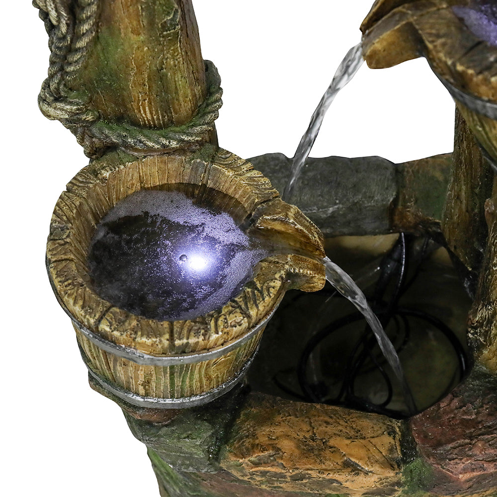 Close-up of the circulating water flow into the realistic faux brick wishing well basin