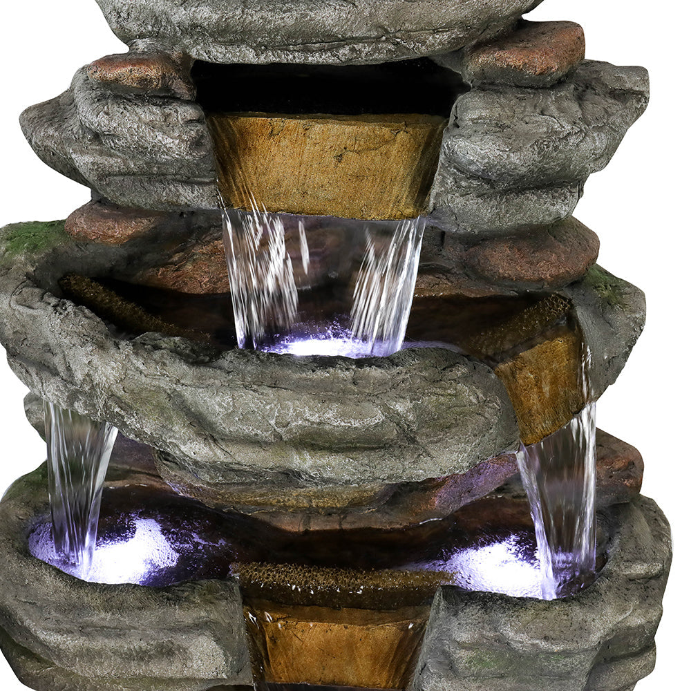 Close-up of the soothing water cascading from the top shale rock tier of the large fountain