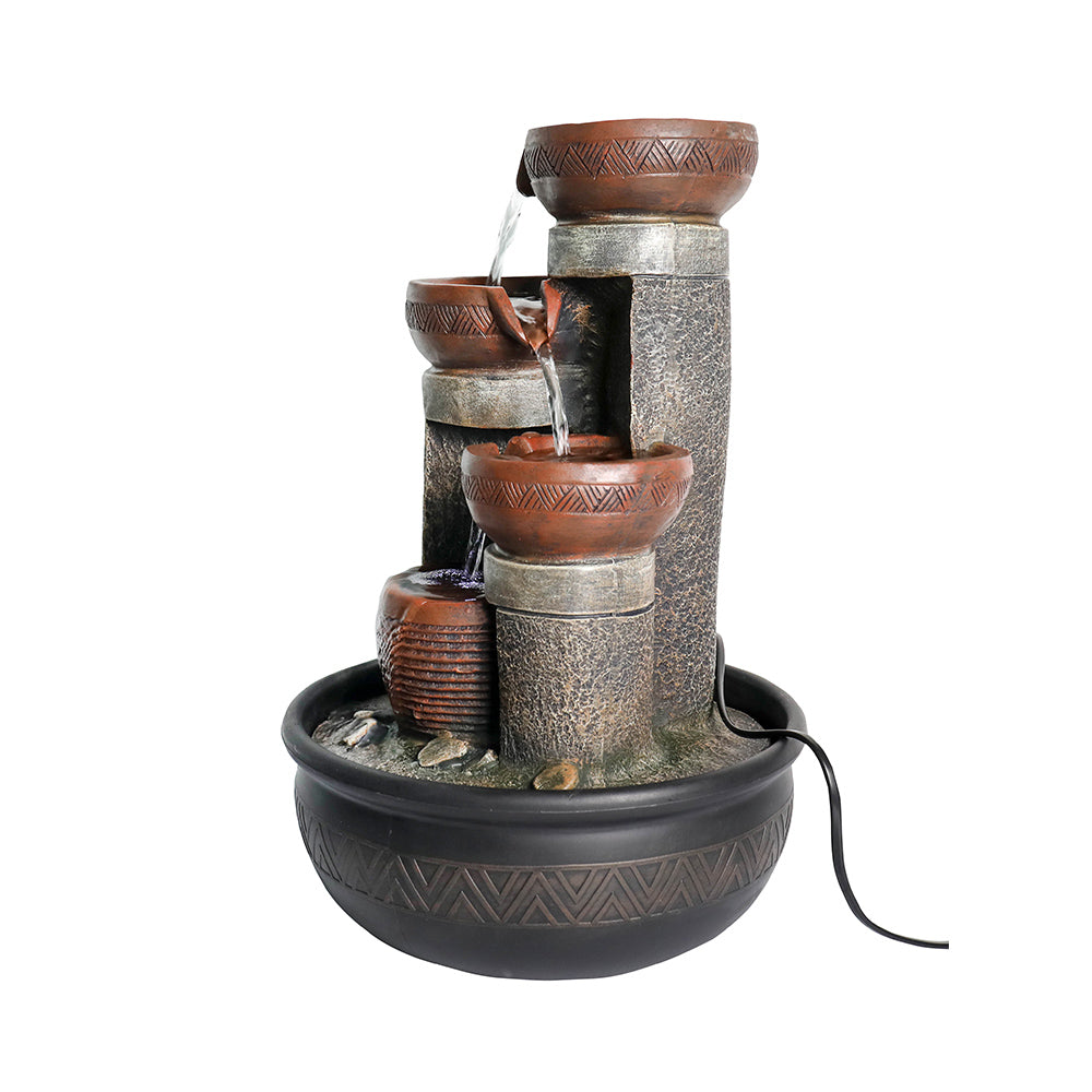 Focused view of the right side base of the fountain with the power cord trailing away.