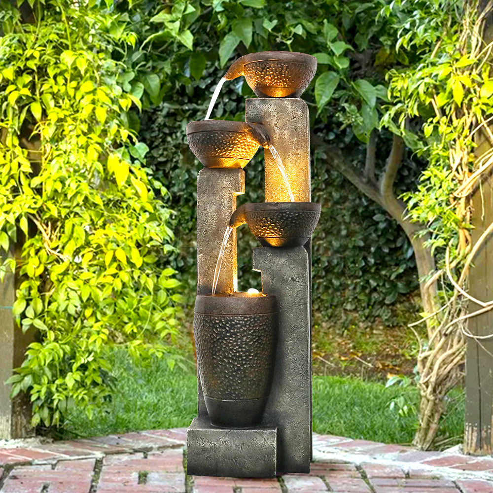Lighted outdoor fountain serving as a stunning centerpiece for a modern patio