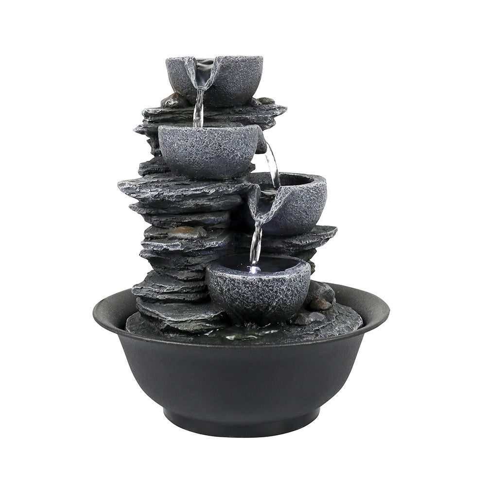 Right side view of the light gray resin cascading bowl fountain on white