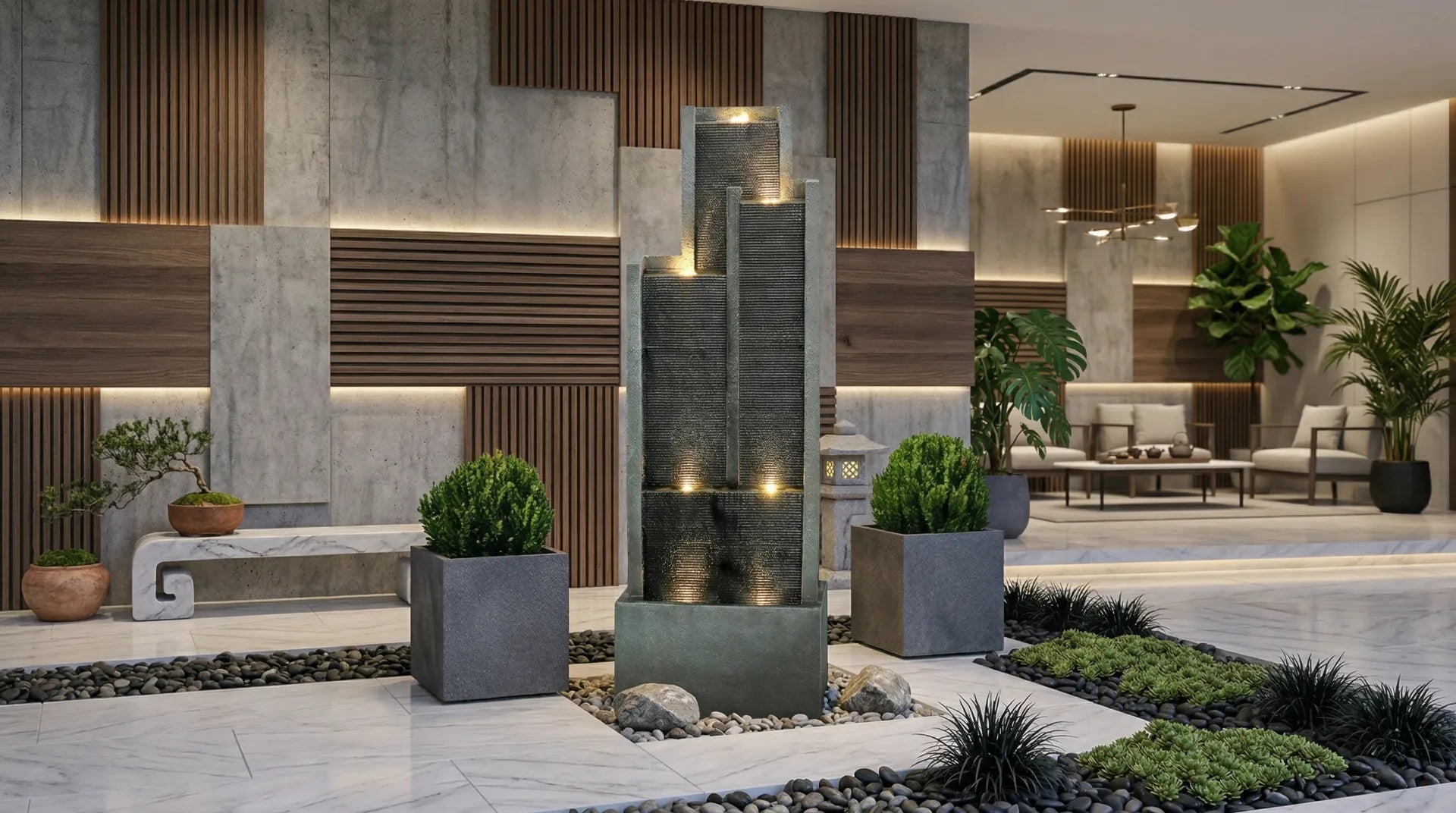 Modern interior courtyard with an illuminated, tiered black floor fountain at its center.