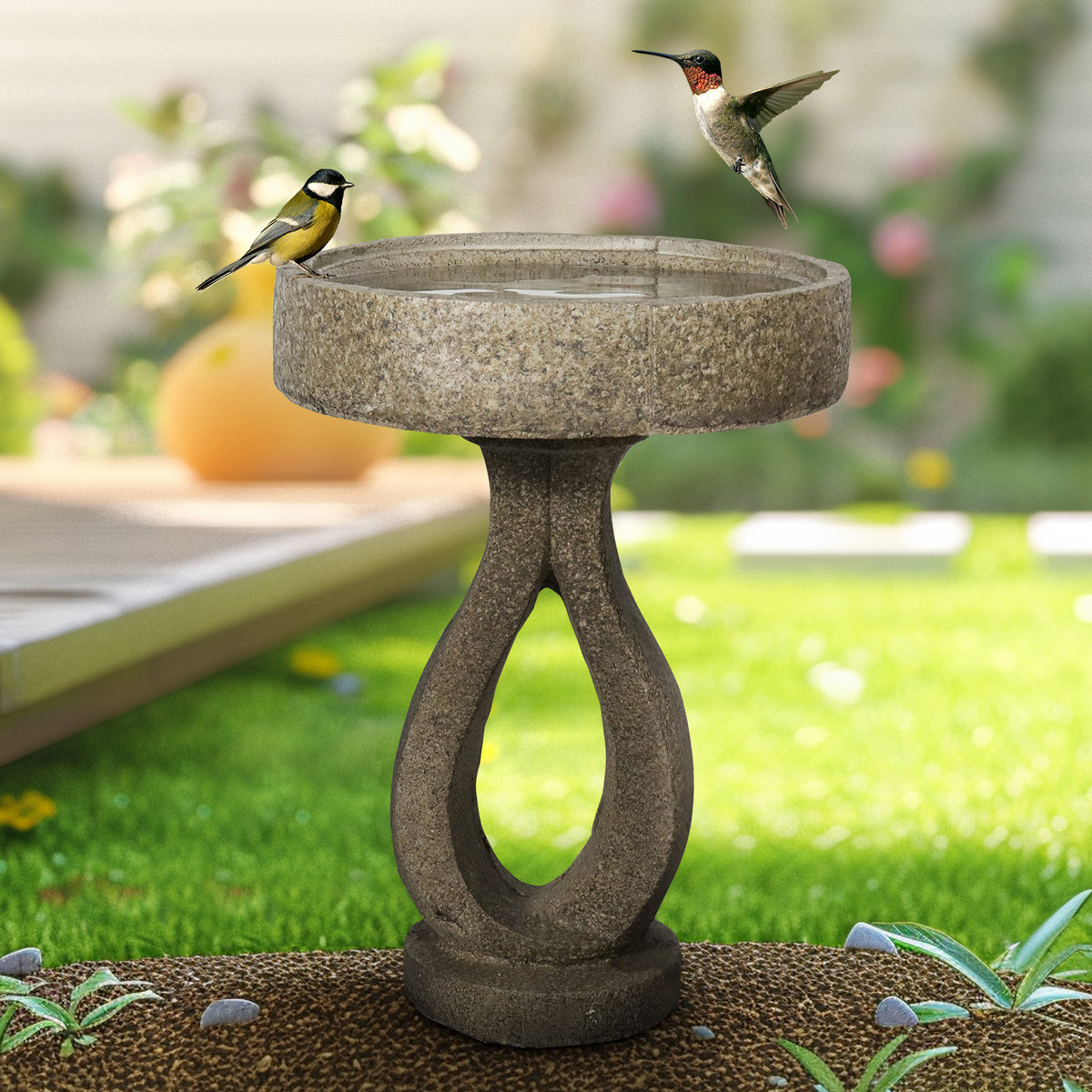 21.8"H elegant modern concrete bird bath serving as a sleek focal point on a sunny green lawn.