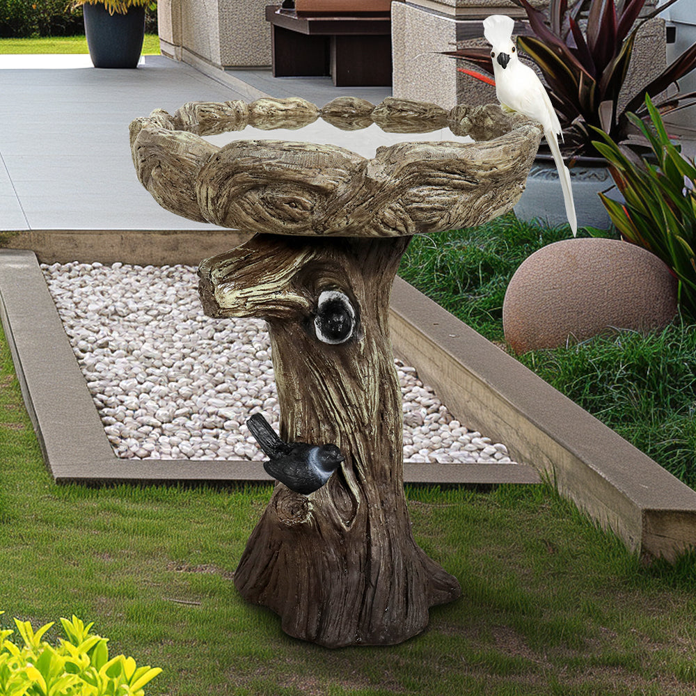 23.8" tall concrete bird bath fountain in a lush green garden