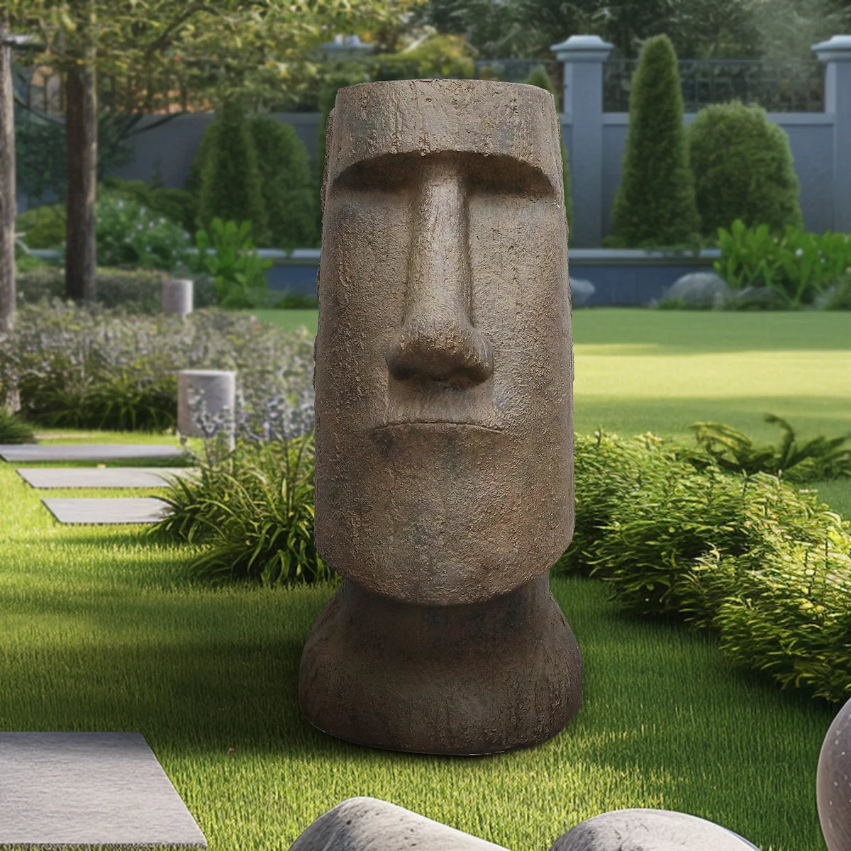 35.6-inch concrete Easter Island head decorating a peaceful backyard