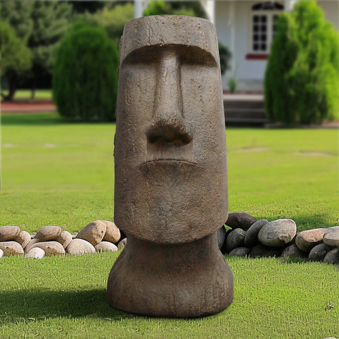 35.6" tall Moai Easter Island head sculpture nestled in a green garden