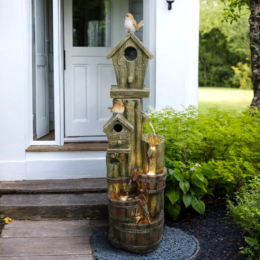 39.3"H rustic birdhouse water fountain creating a vivid ambiance along a garden path