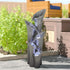 39.4"H faux stone outdoor fountain creating a tranquil atmosphere on a modern patio