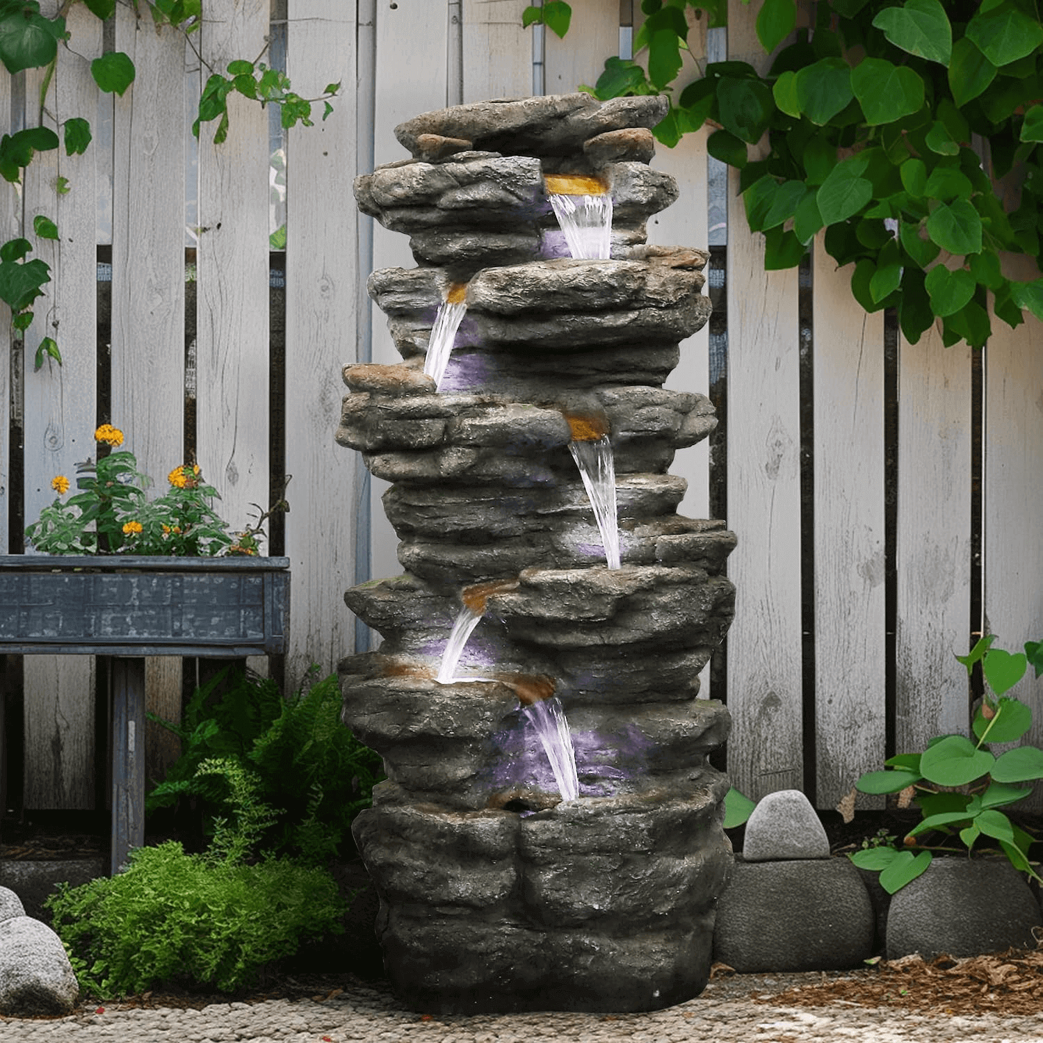 40.5 inch 6-tier cascading waterfall fountain enhancing a peaceful backyard landscape
