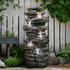 40.5 inch 6-tier cascading waterfall fountain enhancing a peaceful backyard landscape
