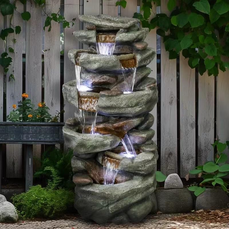 40.5 inch tall 6-tier rock waterfall fountain creating a relaxing oasis in a backyard patio