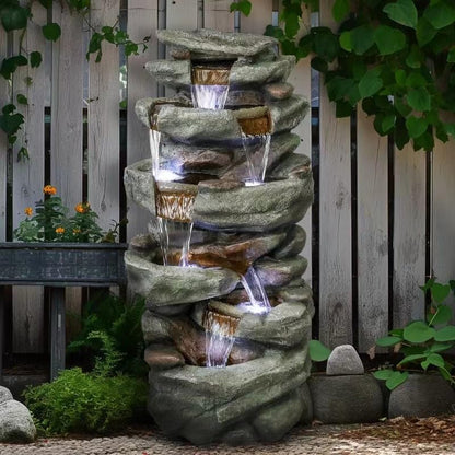 40.5 inch tall 6-tier rock waterfall fountain creating a relaxing oasis in a backyard patio