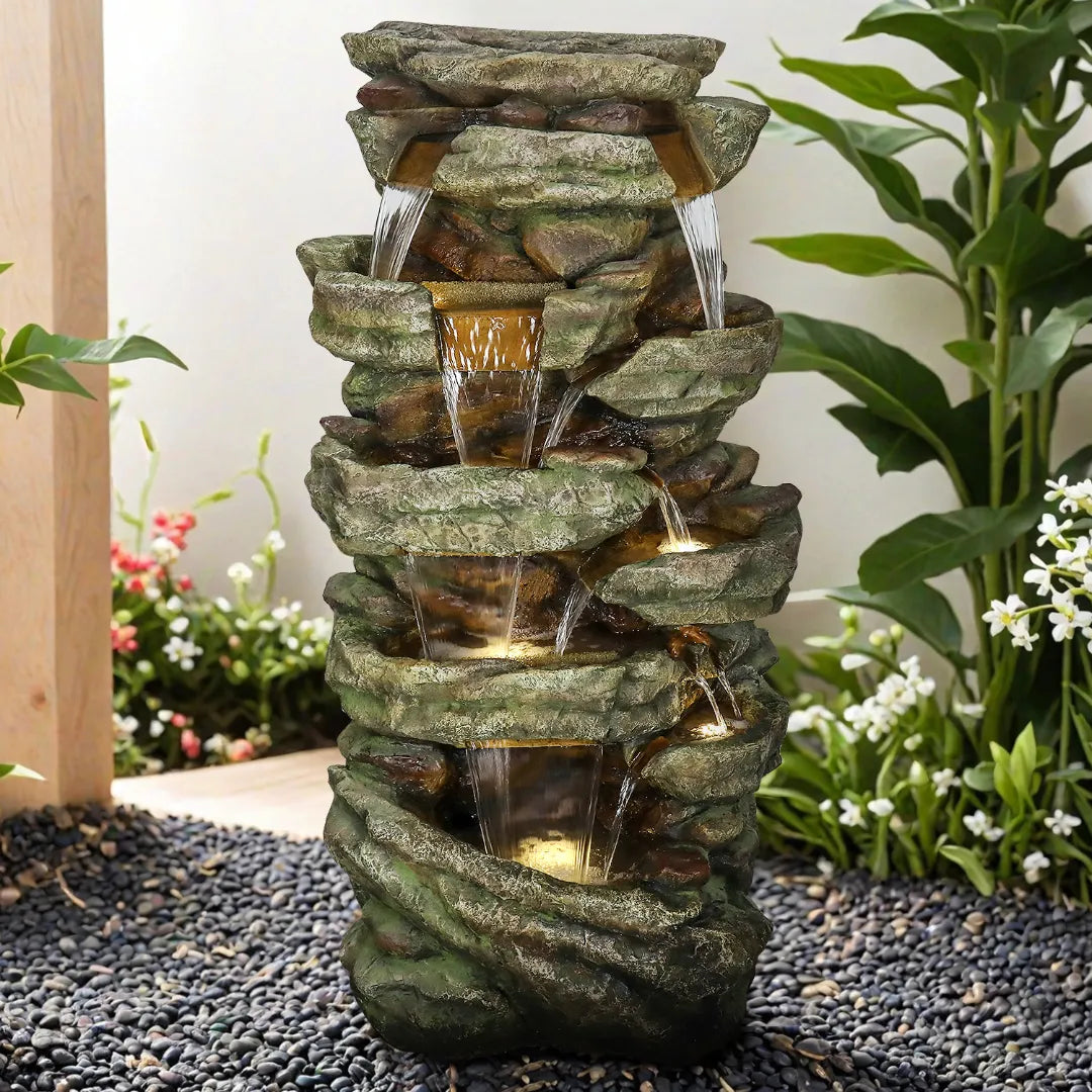 59-inch tall multi-tier rock waterfall fountain in a beautiful garden