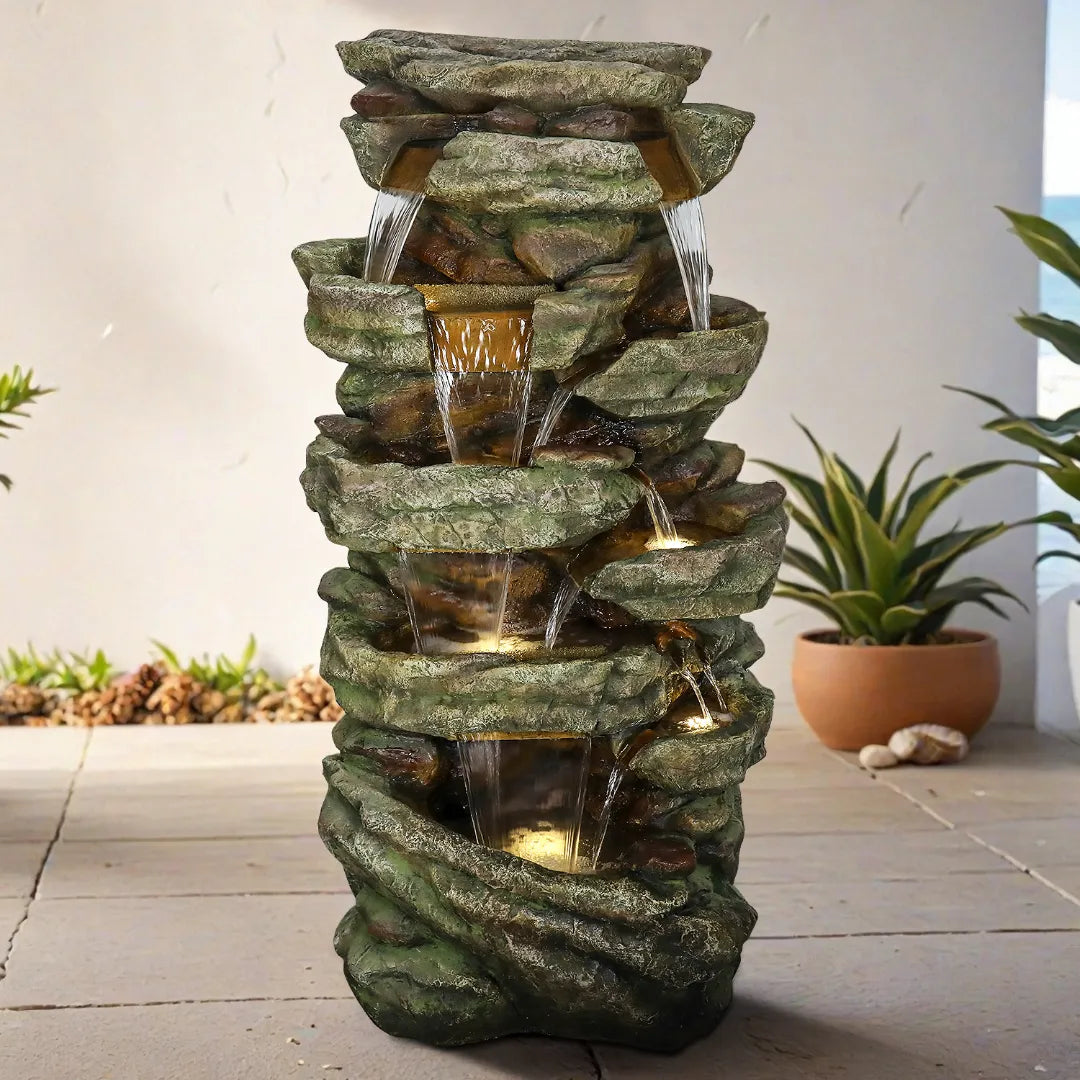 59"H rock waterfall serving as a grand patio centerpiece