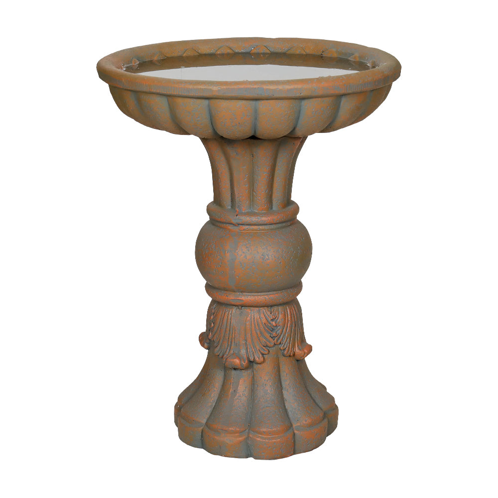 A classical-style birdbath filled with water