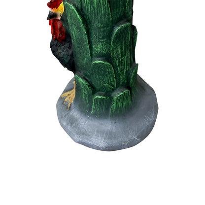 Close-up of the green leaf stalk pedestal and the sturdy base of the concrete bird bath.