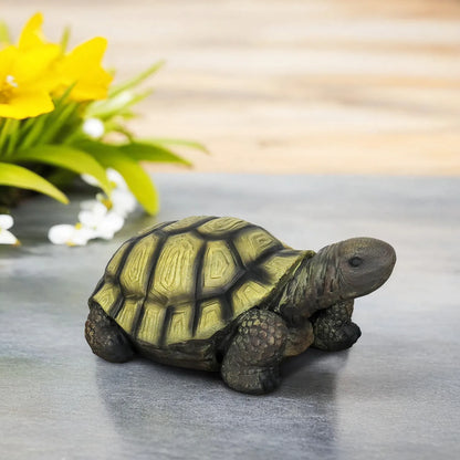 Close-up of the hand-painted shell detail on the seated tortoise garden sculpture.