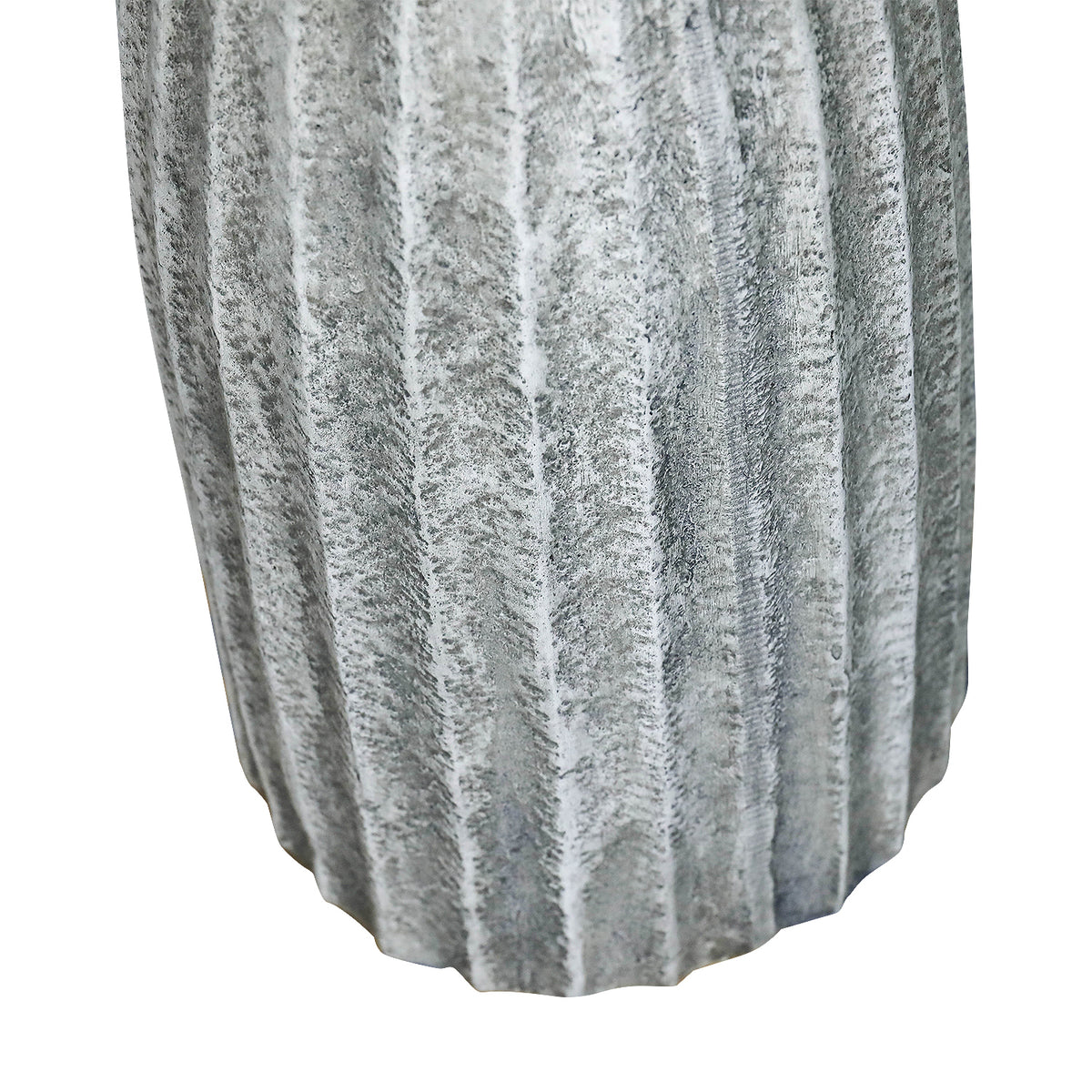 Close-up of vertical fluted concrete column pedestal showing texture detail