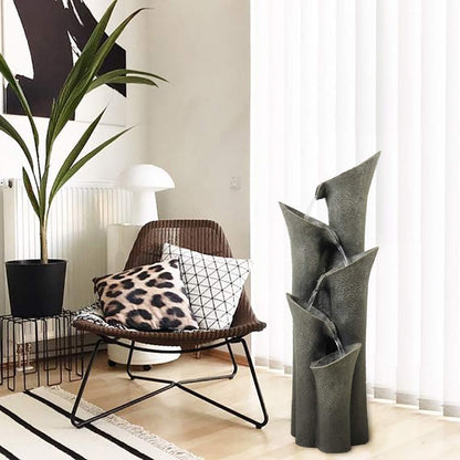 Contemporary floor fountain acting as a soothing focal point in an indoor living room