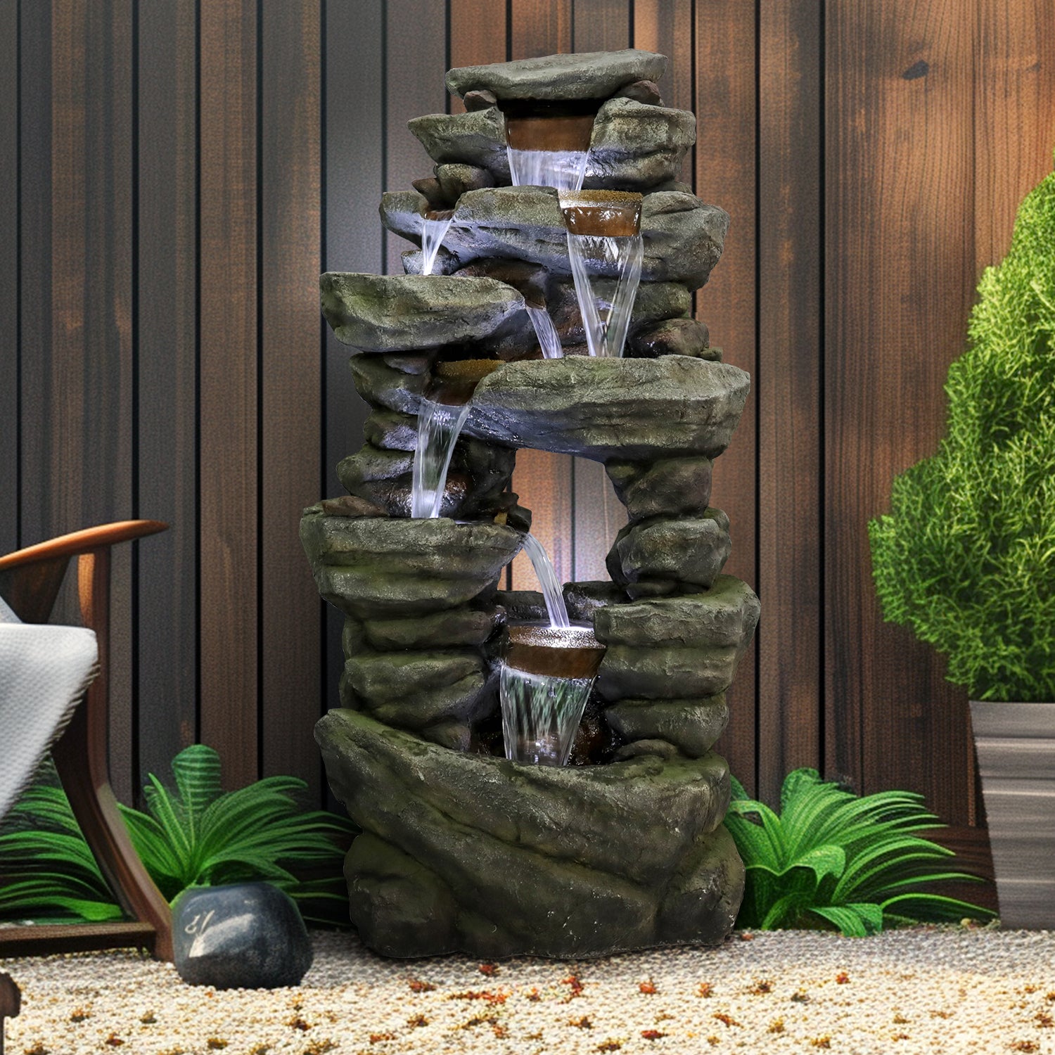 Cozy outdoor deck decorated with the 60" tall natural stone look cascading water feature.