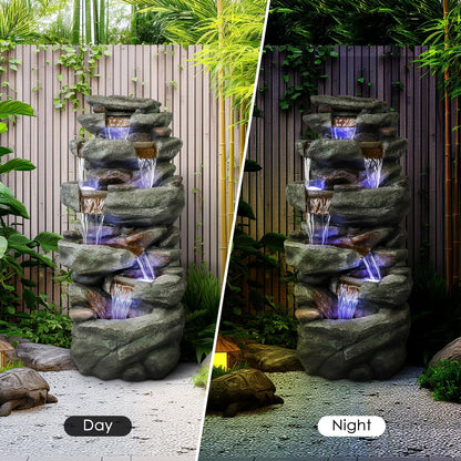 Day and night contrast of the rock waterfall fountain showing the 6 LED lights at night