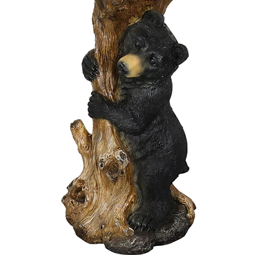 Detailed close-up of the hand-painted fur texture on the black bear garden statue.