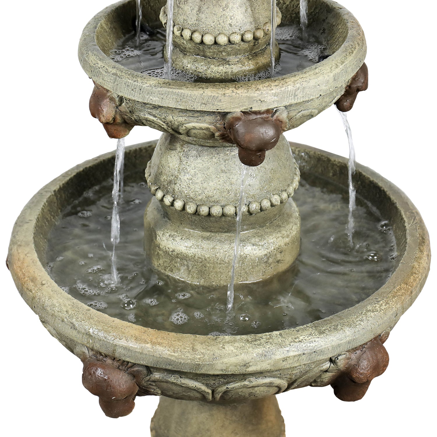 Detailed shot of water cascading from the intricate lion head motifs on the 3-tier garden waterfall.