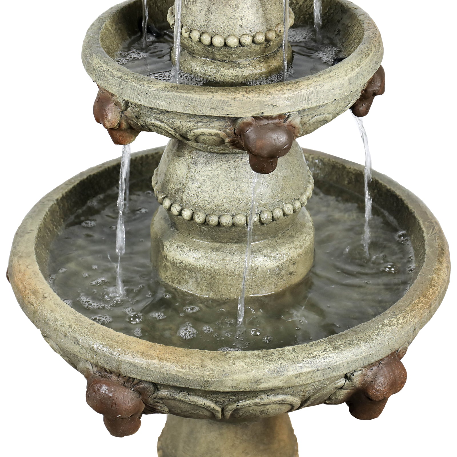 Detailed shot of water cascading from the intricate lion head motifs on the 3-tier garden waterfall.