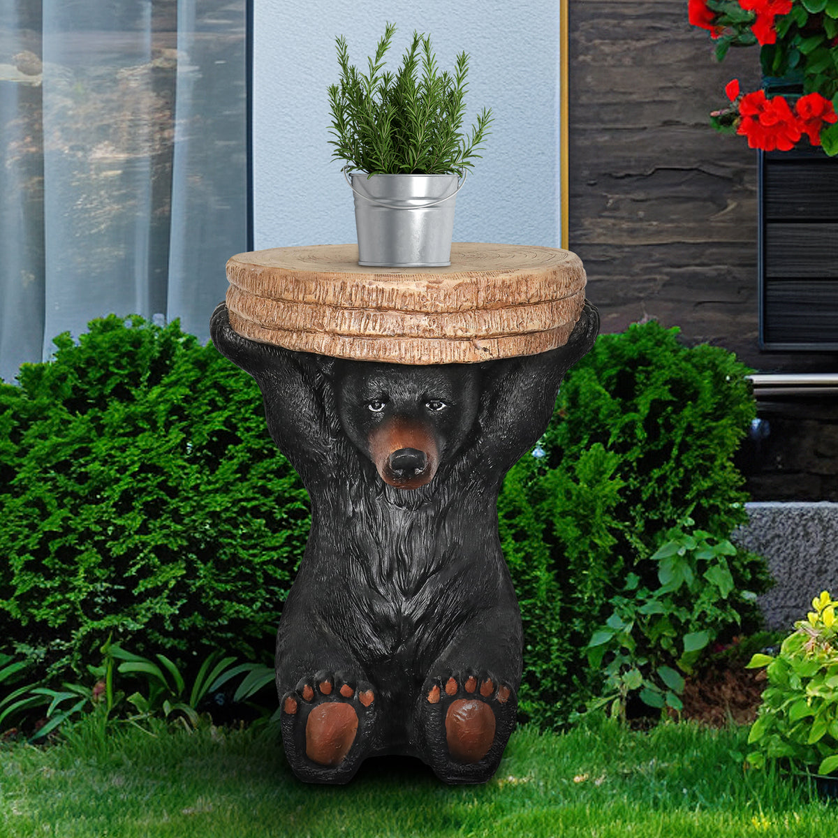 Durable cement bear statue table holding a drink on an outdoor patio