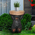 Durable cement bear statue table holding a drink on an outdoor patio