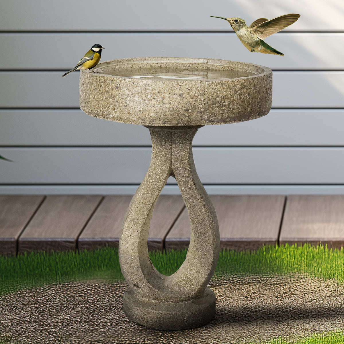 Elegant 21.8"H modern concrete bird bath enhancing the natural beauty of a backyard wooden deck.