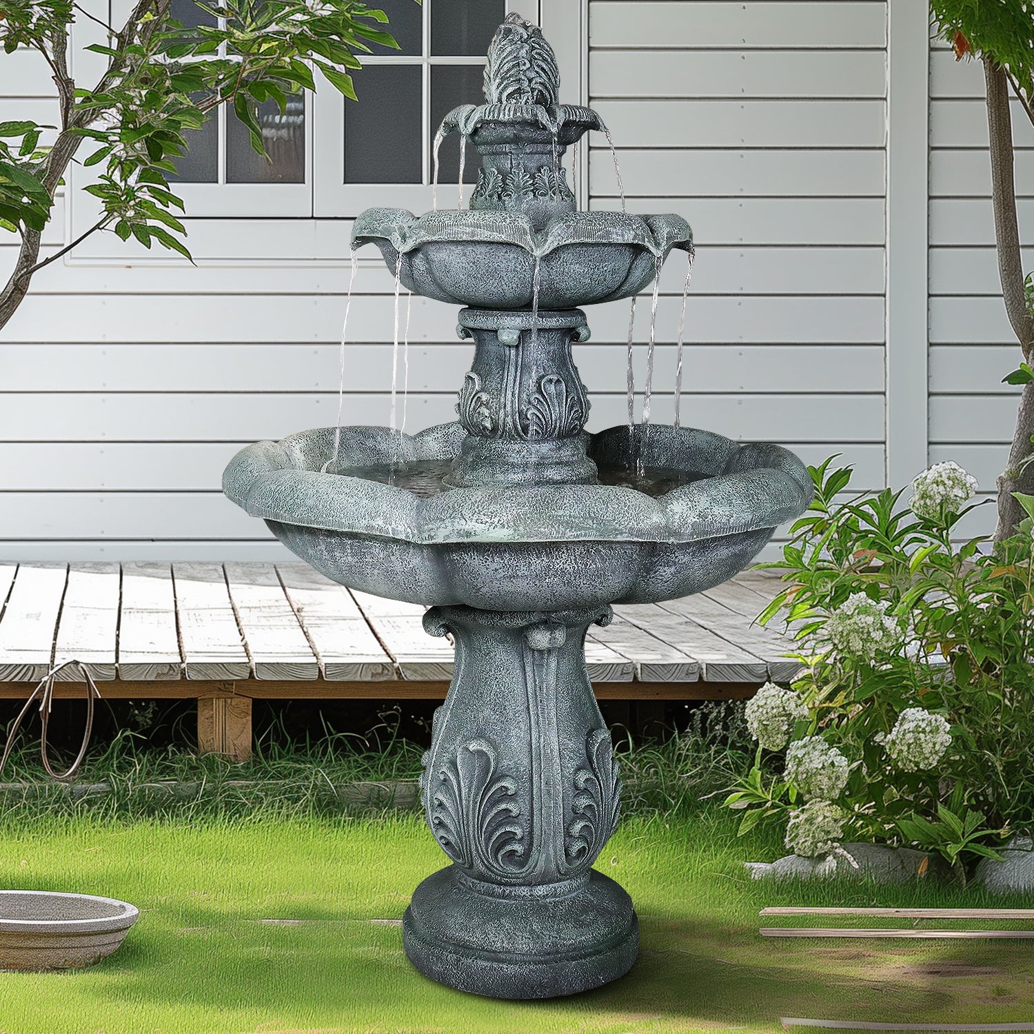 Elegant outdoor garden waterfall adding timeless sophistication next to a cozy backyard patio.