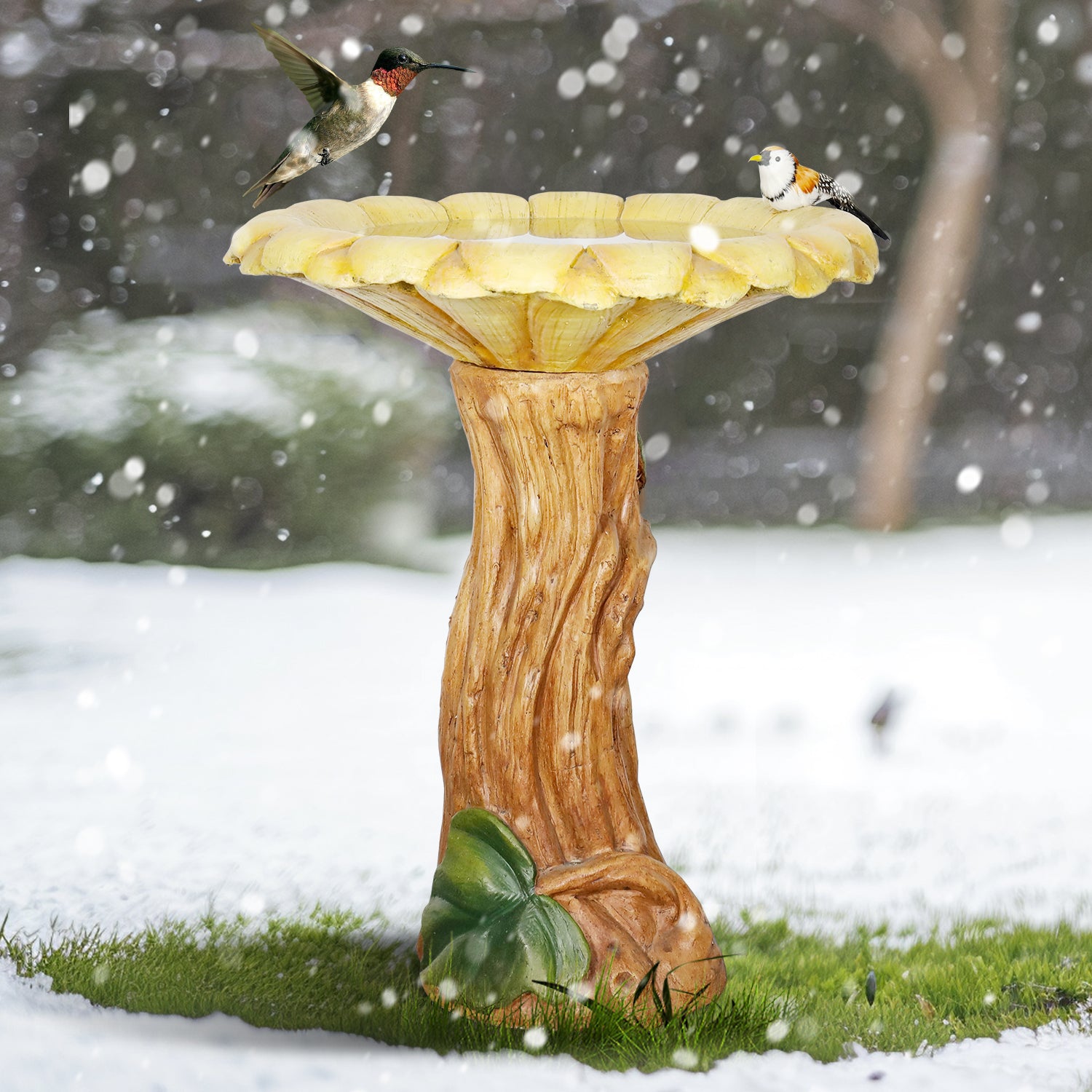 Frost-resistant 24.4"H concrete sunflower bird bath standing durably in a beautiful snowy winter garden.