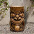Functional concrete Tiki stool used as a patio side table for drinks