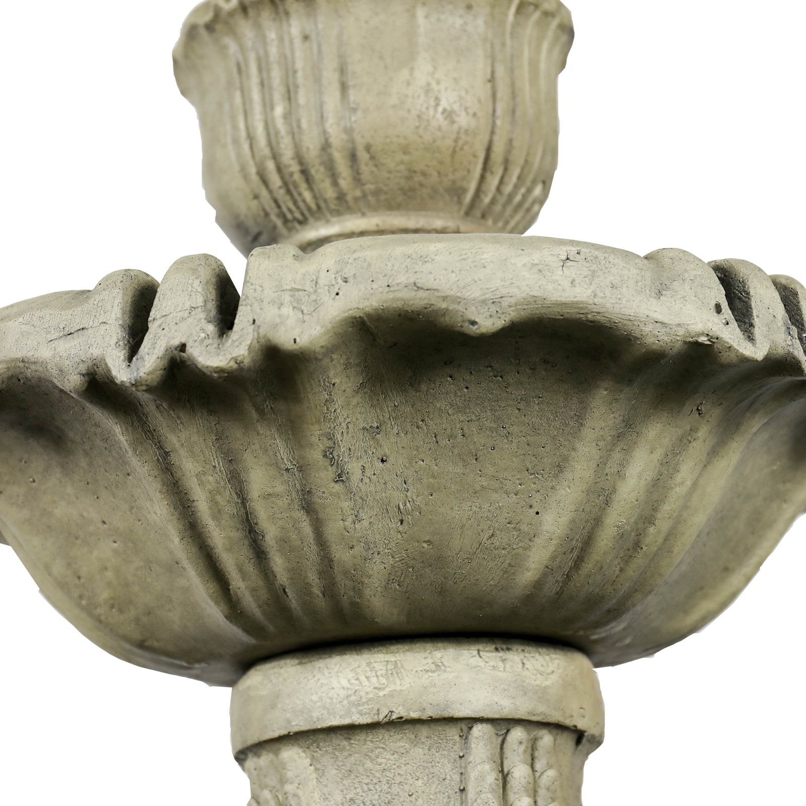 Macro shot of the elegant scalloped edges and stone-like texture of the 3-tier water feature.