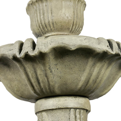 Macro shot of the elegant scalloped edges and stone-like texture of the 3-tier water feature.
