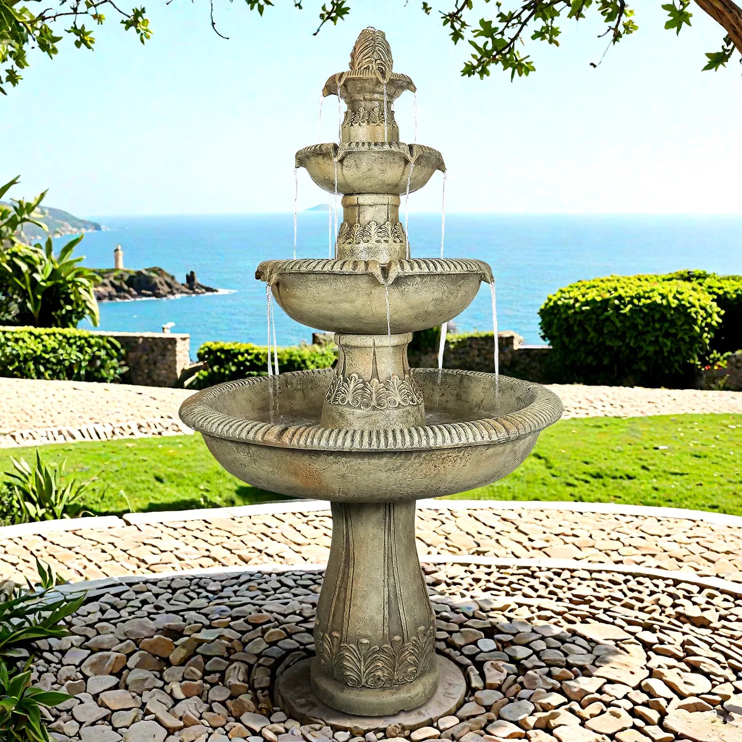 Majestic 3-tier concrete fountain with a panoramic view of the coastline in the background.
